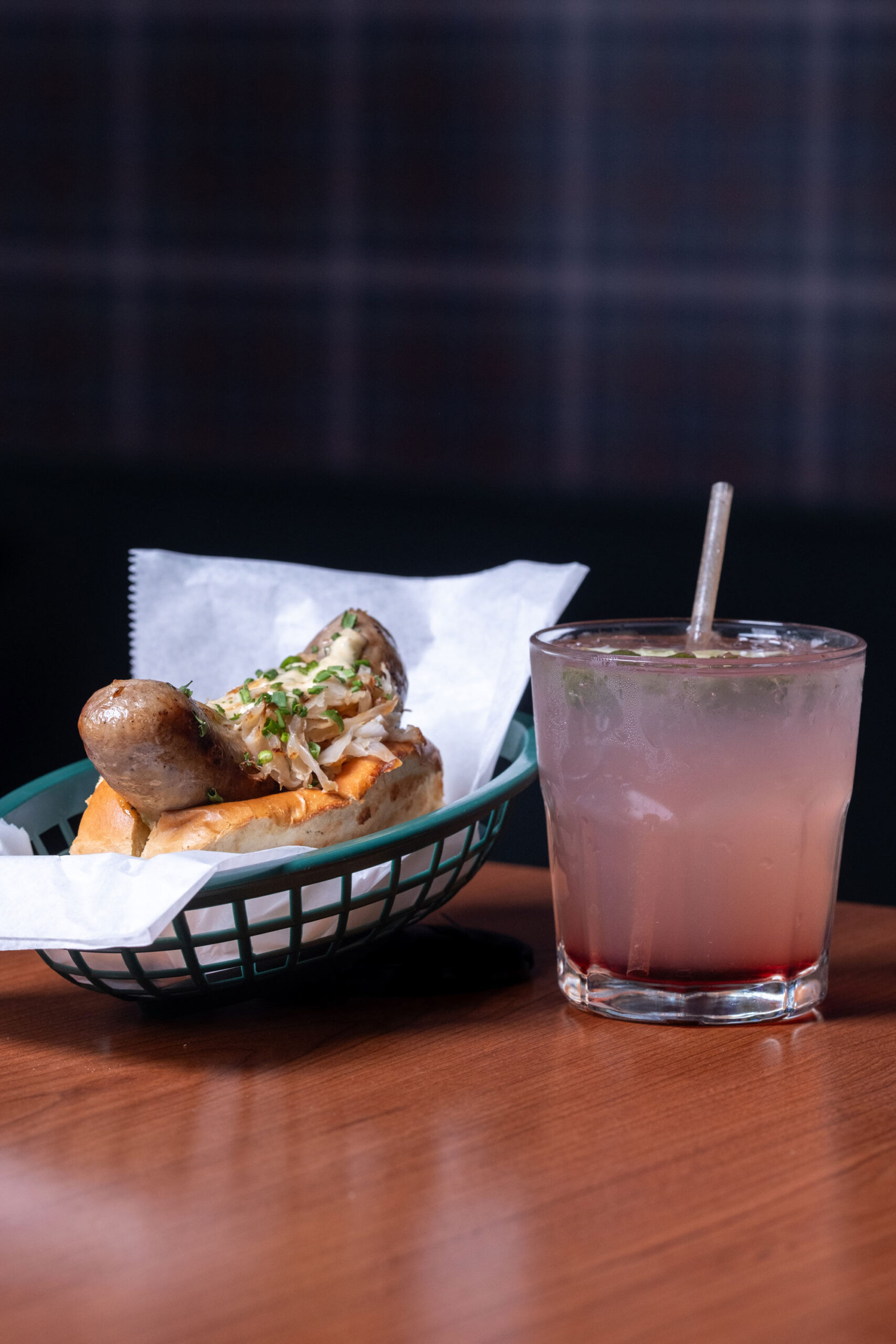 Timecard Turner Bratwurst topped with sauerkraut, sautéed onions, and boss sauce.